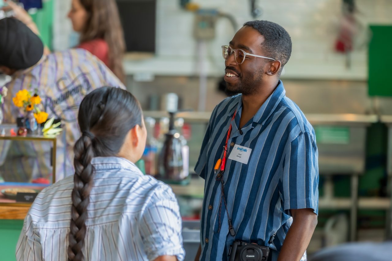 Attendees talking at tables during a small business event