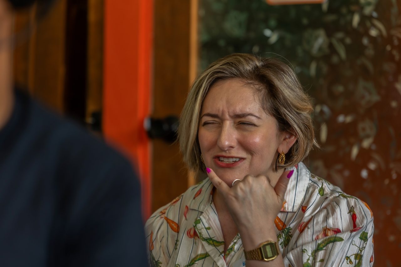 Guest laughing during a conversation at a networking event
