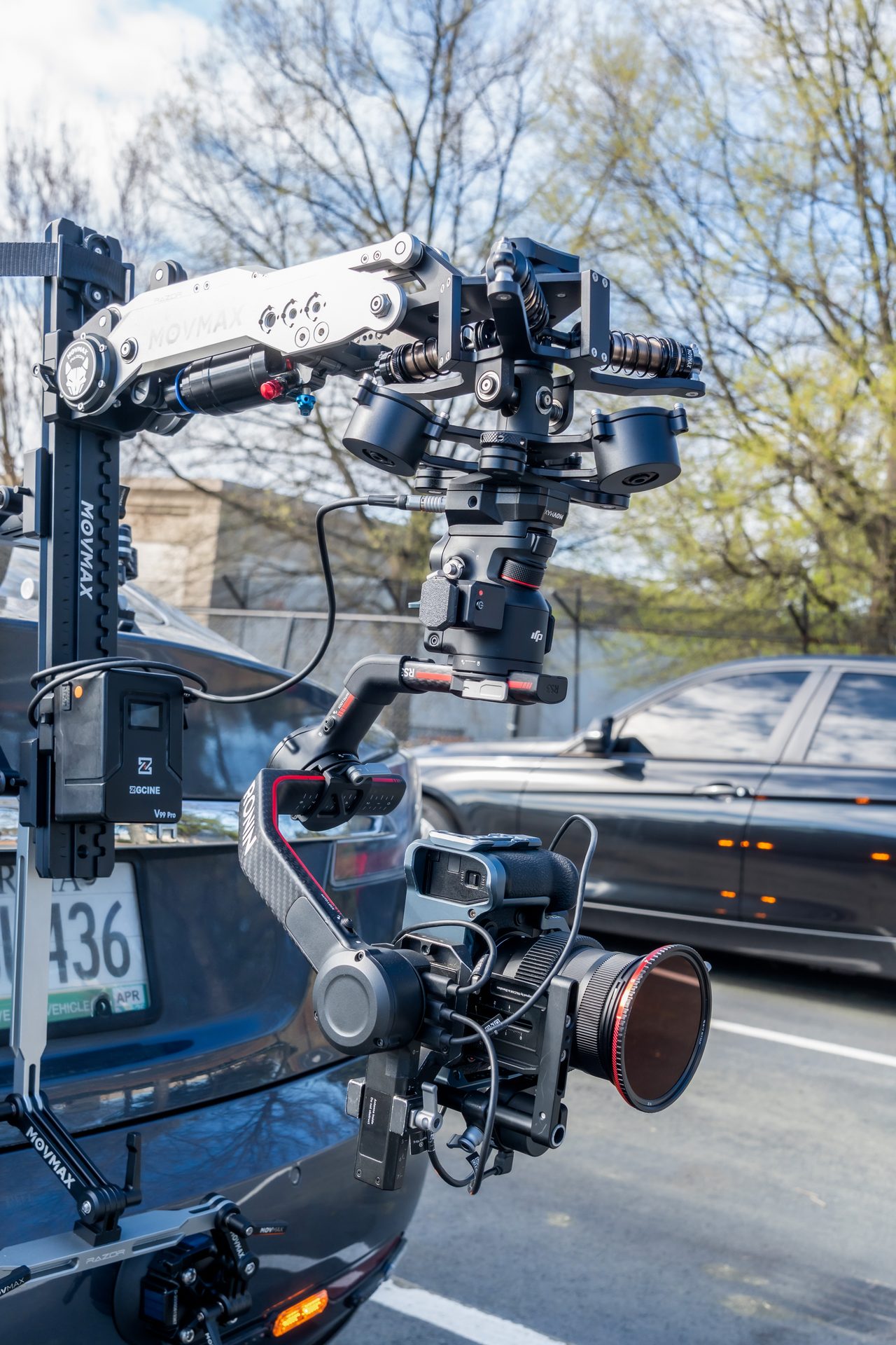 Gimbal arm car mount rig attached to a Tesla
